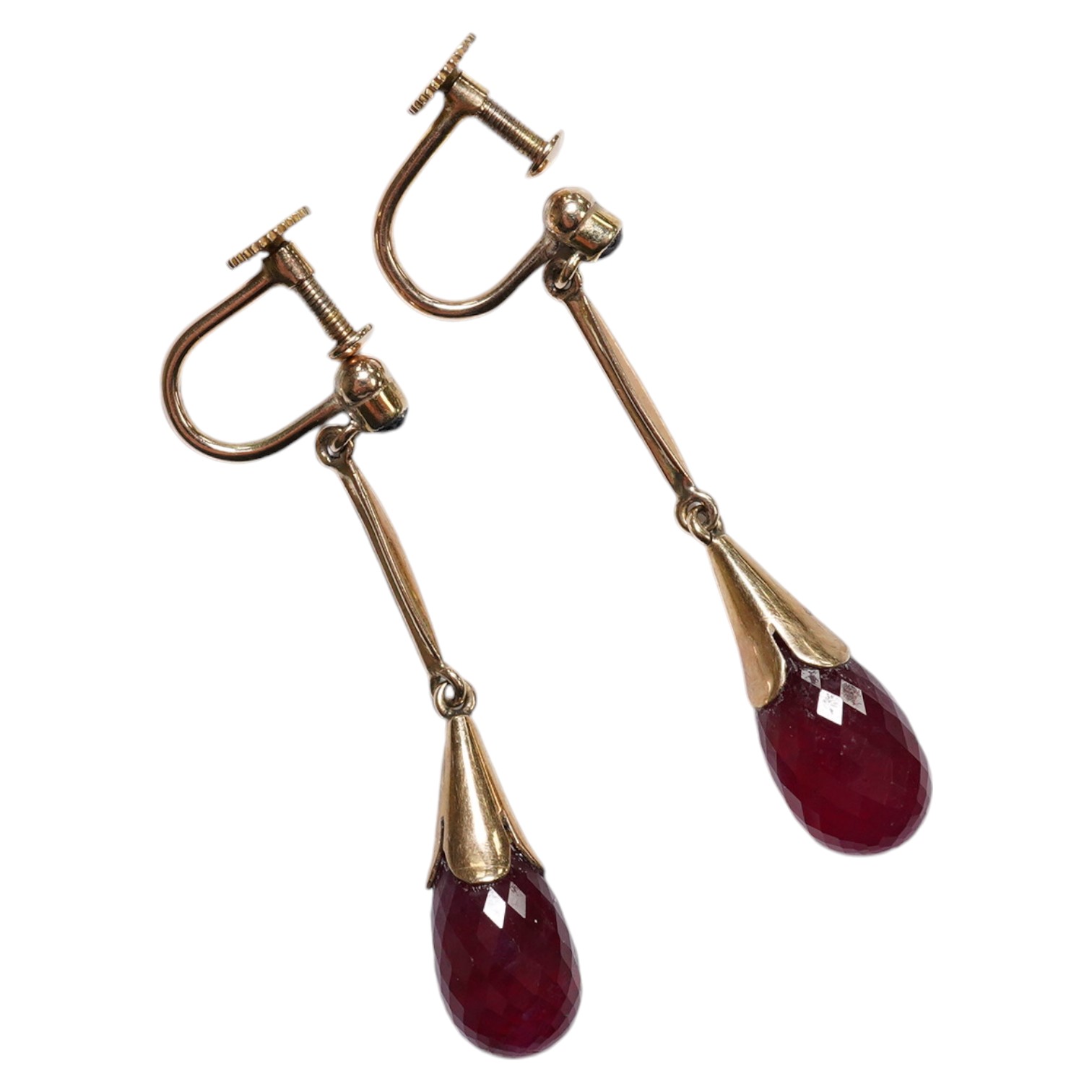 A pair of 9ct and facetted cut oval ruby set drop ear clips, 35mm. Condition - fair